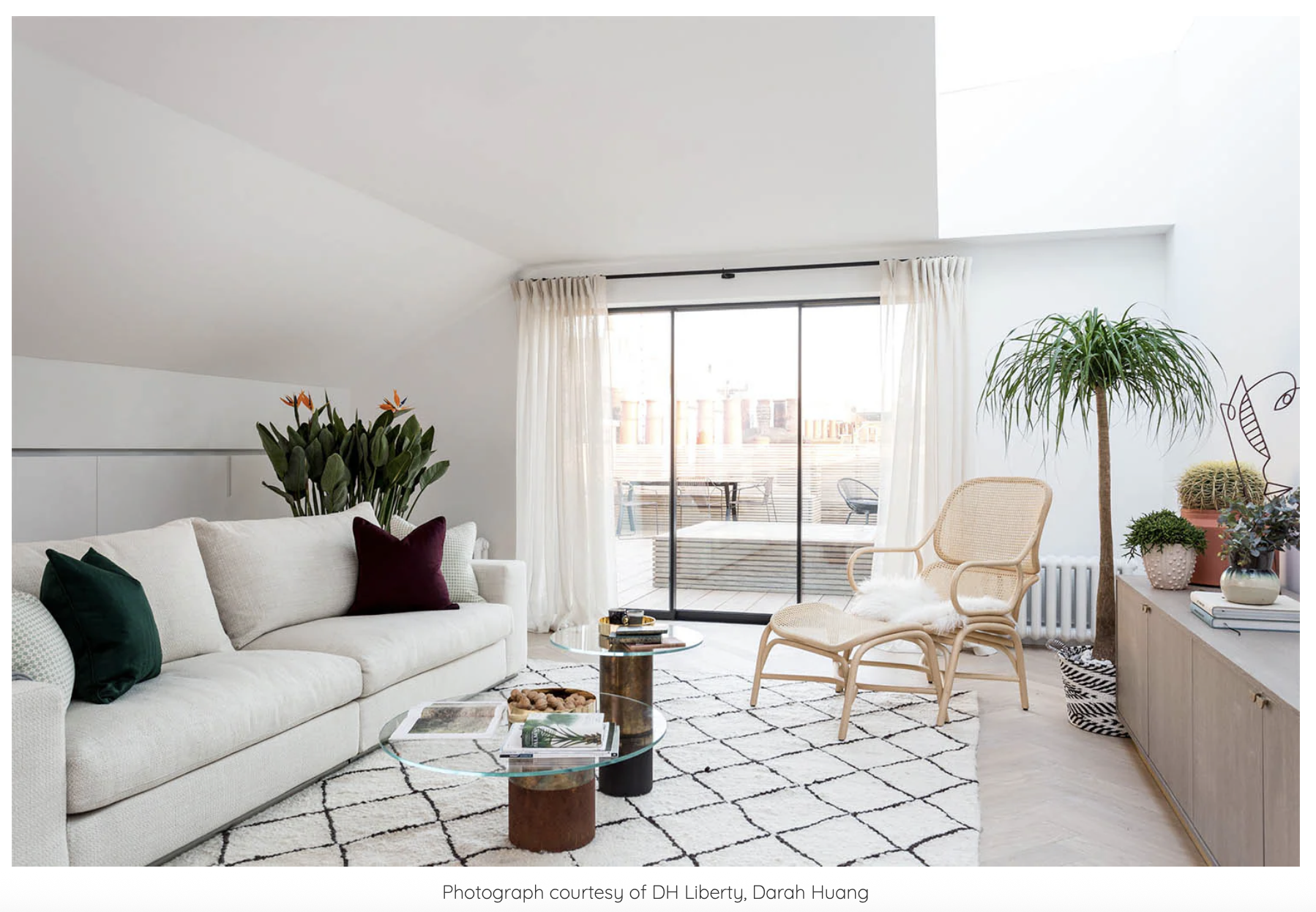 Berber Handwoven Custom Rug by Coral and Hive in Living Room with Cream Sofa and Glass and Wood Coffee Table