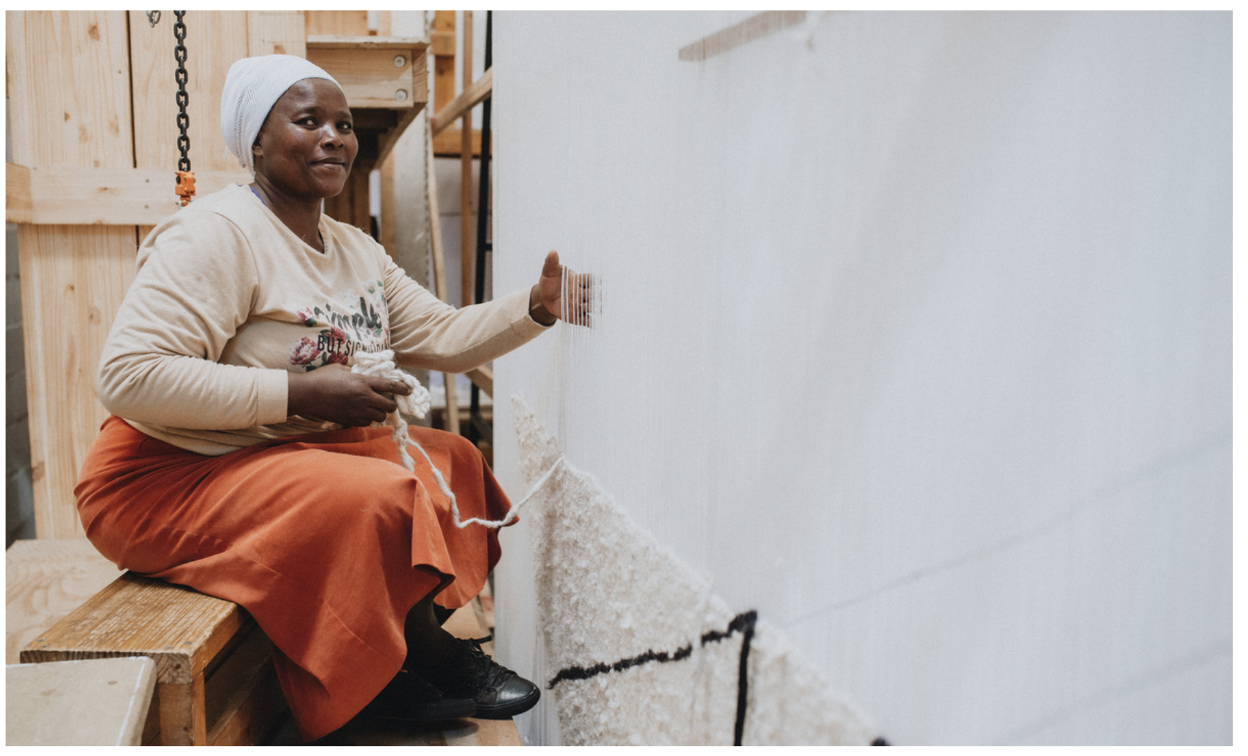 Coral and Hive Weaver with Handwoven Custom Rug in Curly Mohair and White and Chocolate African Wool at South African Loom